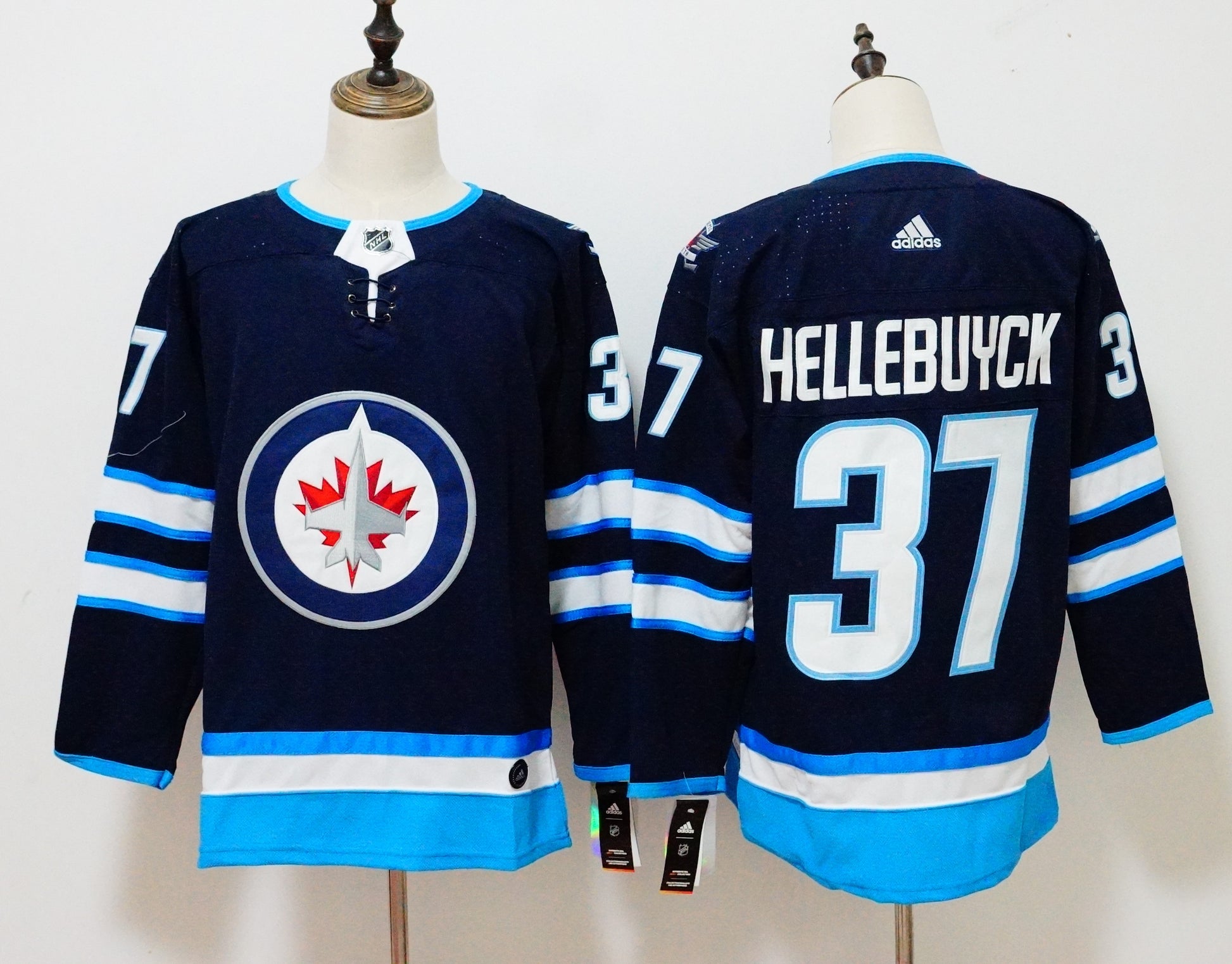 Connor Hellebuyck Winnipeg Jets navy jersey